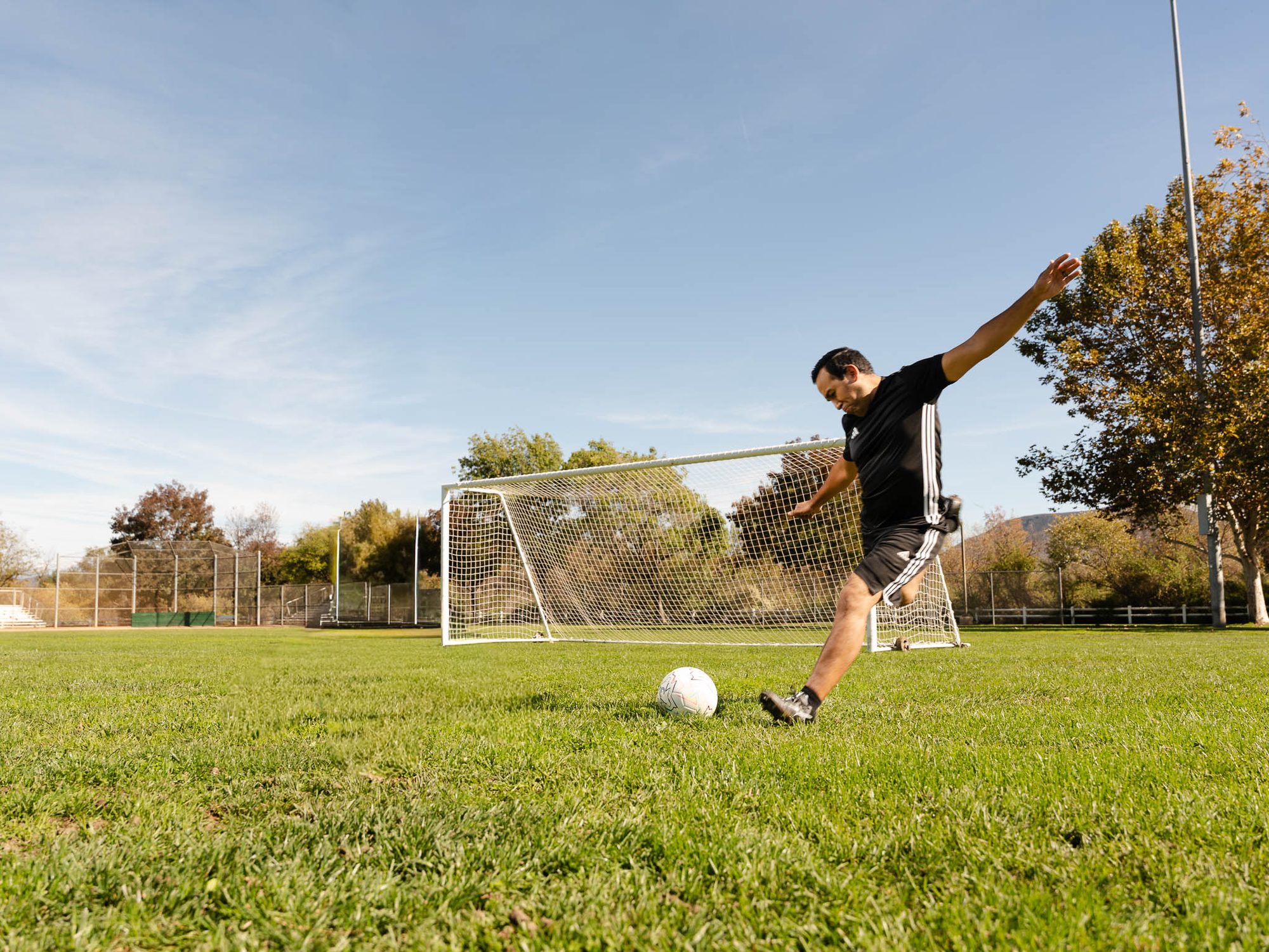 Dr. Anthony Gallegos on a community soccer pitch