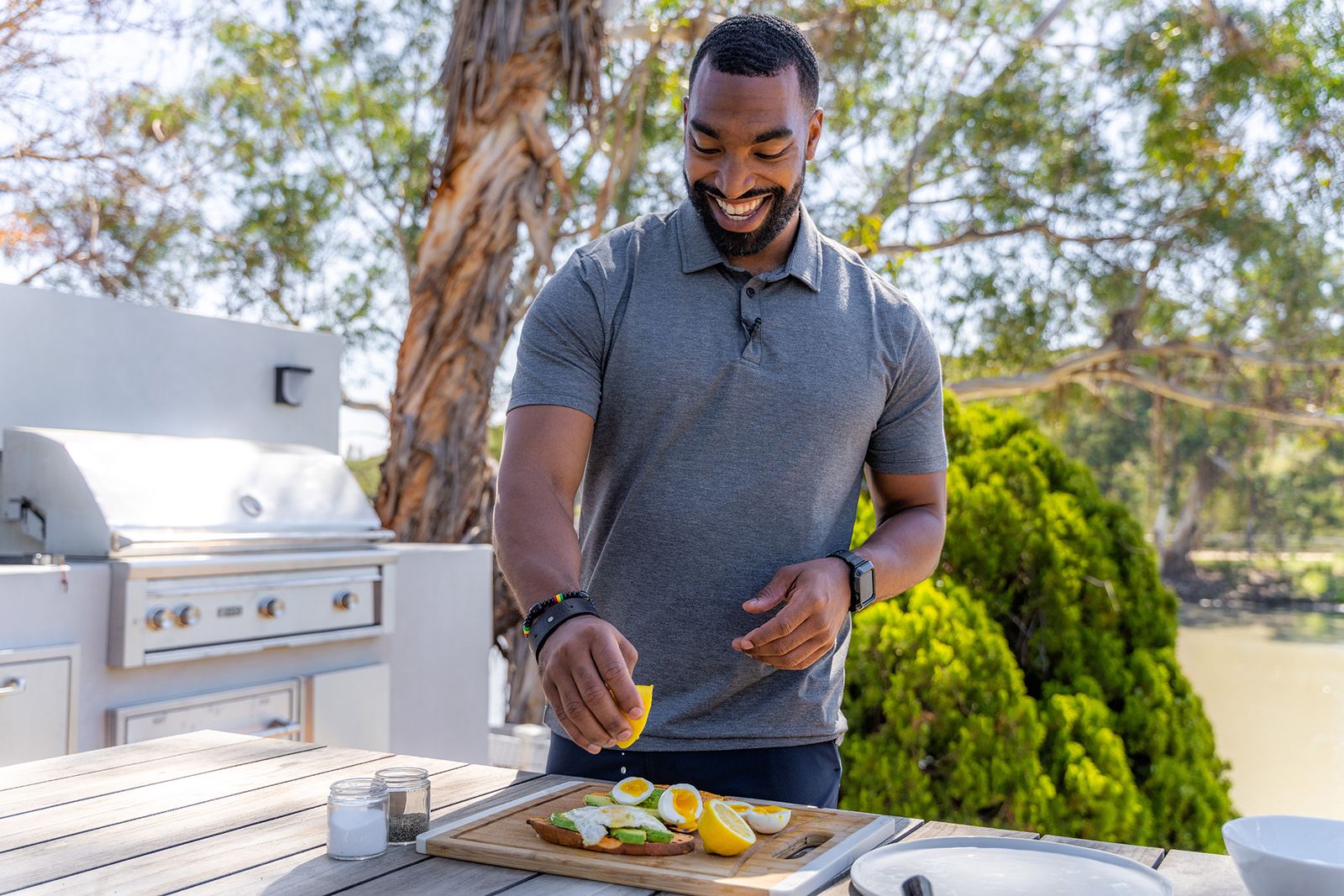Dr. Kyle Vincent cooking at an outdoor kitchen